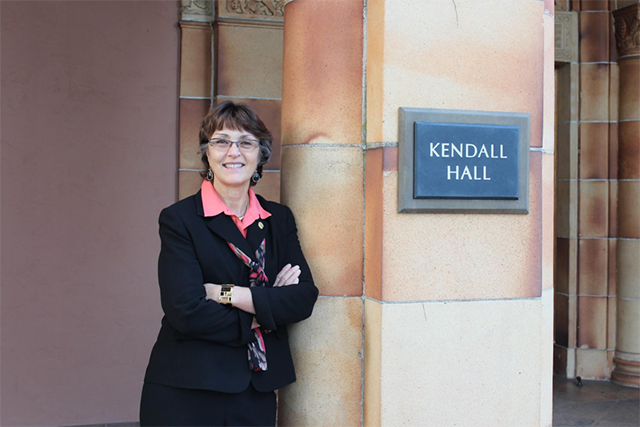 Gayle Hutchinson in front of Kendall Hall