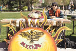 Mecha De Chico State member sits at their table at the Cesar Chavez Educational Fair