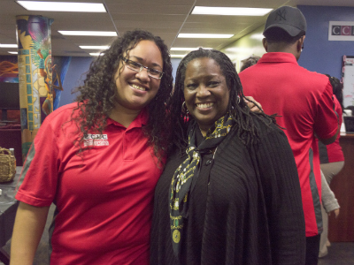 Member of the Cross Cultural Leadership Center Krystal Johnson  and Professor Lisa Johnson smile together at during an event at the CCLC
