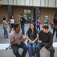 Chico State students enjoying each others' company on campus. 